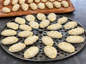 Afghan Mantu Recipe served with yogurt and tomato sauce