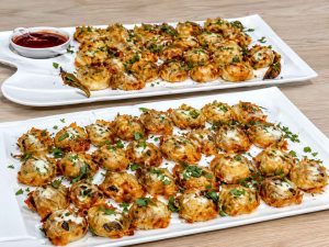 Easy Mantu Recipe served with garlic yogurt and tomato sauce