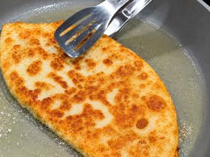 Frying Bolani in a pan