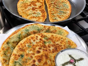 Bolani served with yogurt