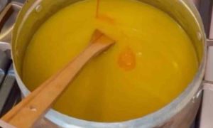 Cooking kachi in a copper pot