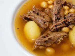 Authentic Azerbaijani Piti served in a traditional clay pot with tender lamb and chickpeas
