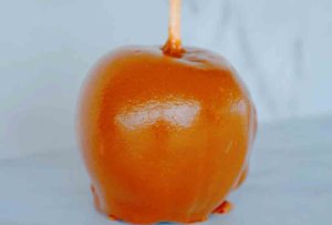 Caramel apple with caramel and sweet chocolate