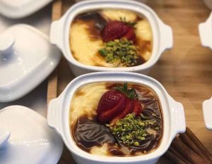 Sutlac recipe decorated with strawberries and cinnamon