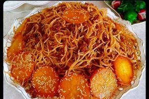 Iranian macaroni with potato and sesame bottom