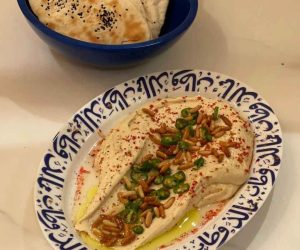 Hummus with fresh olives and almonds
