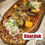 Kuurdak on a wooden tray