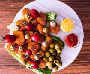 Chicken cheese cutlets with tomato and olives