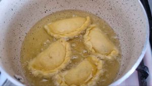 Frying Ghottab in plenty of oil