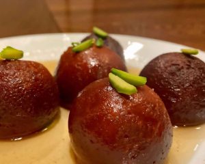 Gulab Jamun with pistachio powder