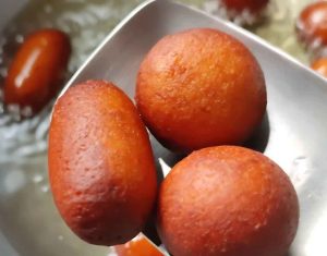 Gulab Jamun fried in hot oil