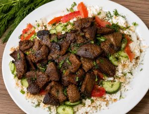 Authentic Tajik Qurutob served with yogurt sauce