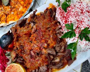 Iskender Kebab with plenty of tomato sauce