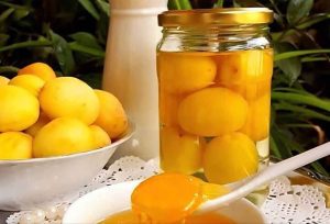 Apricots and a container of compote ready with a simple apricot compote recipe