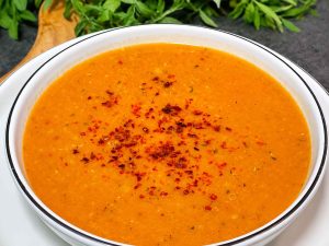 Warm Ezogelin soup served with crusty bread and lemon.