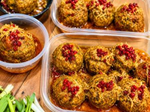 Freshly cooked Koofteh Tabrizi garnished with parsley and served hot