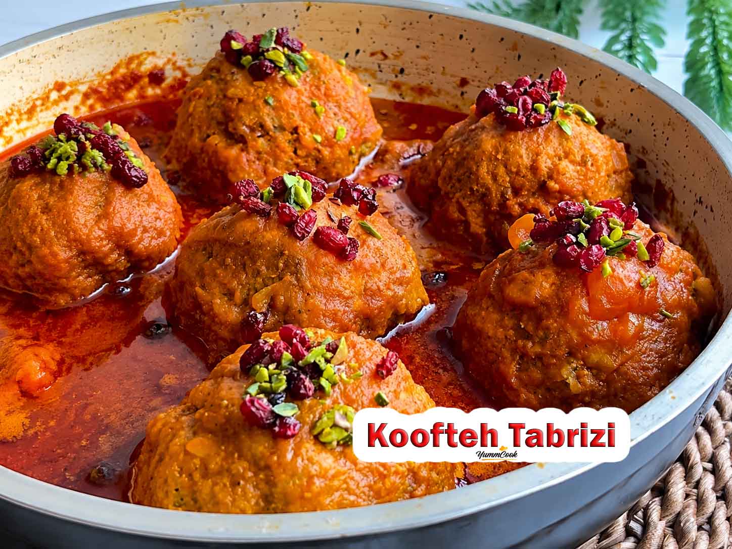 Authentic Koofteh Tabrizi served in rich tomato broth with fresh herbs