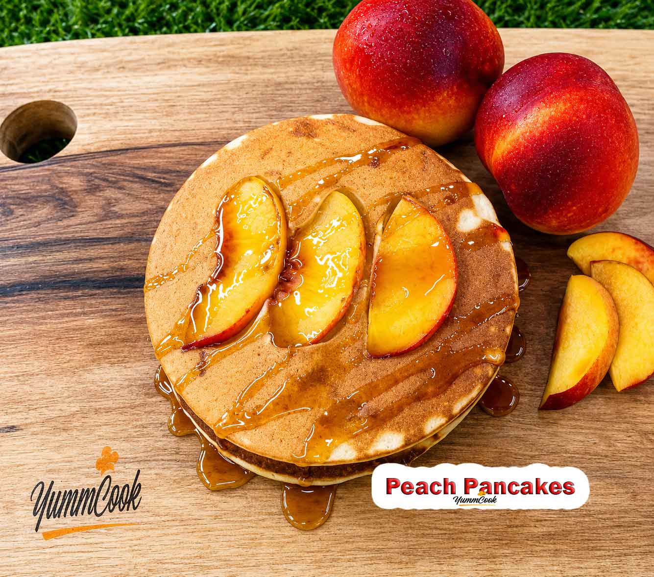 Fluffy Peach Pancakes topped with fresh peach slices and maple syrup