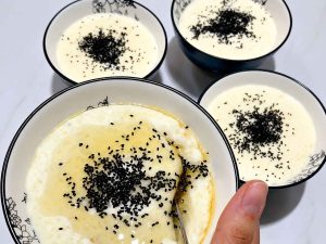 Close-up of Persian rice pudding (Shir Berenj) served as a traditional Iranian dessert.