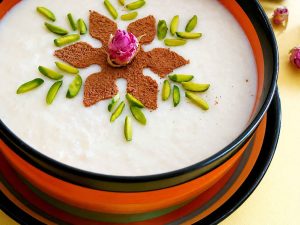 Authentic Iranian rice pudding made with milk, rice, and fragrant rose water.