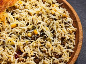 Traditional Iranian Gheymeh Polo with crispy tahdig and fluffy basmati rice