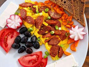 Authentic Sucuklu Yumurta served with warm Turkish bread and fresh parsley