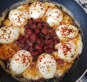 Homemade Sucuklu Yumurta with creamy eggs and spicy Turkish sausage for breakfast
