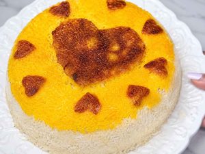 Traditional Persian saffron rice tahdig with a crispy golden crust