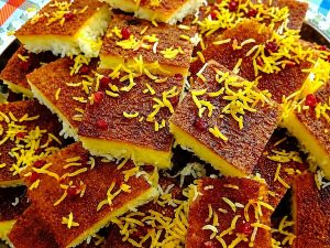 Homemade crispy Persian tahdig with golden saffron rice