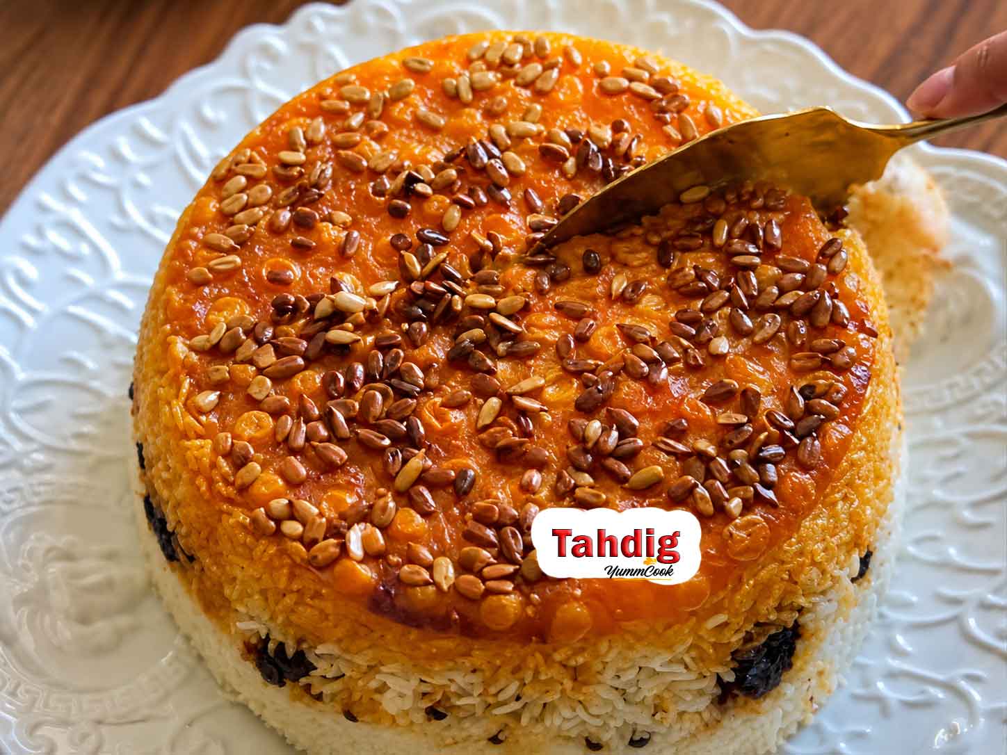 Crispy golden Persian rice tahdig with saffron served on a platter
