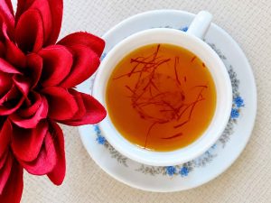Persian saffron tea in a glass cup
