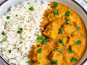 Creamy Indian butter chicken served with basmati rice