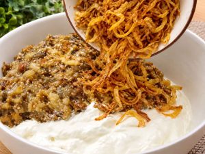 Eggplant dip topped with walnuts and fried onions