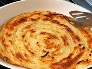 Frying Katlama bread 