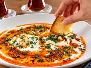 Turkish Eggs recipe served with fresh bread