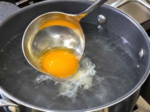 Poaching eggs for Turkish Eggs recipe