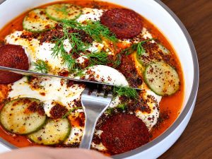 Traditional Turkish Eggs Çılbır with runny yolks