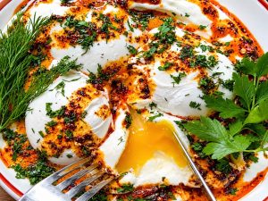 Turkish Eggs recipe served with fresh bread
